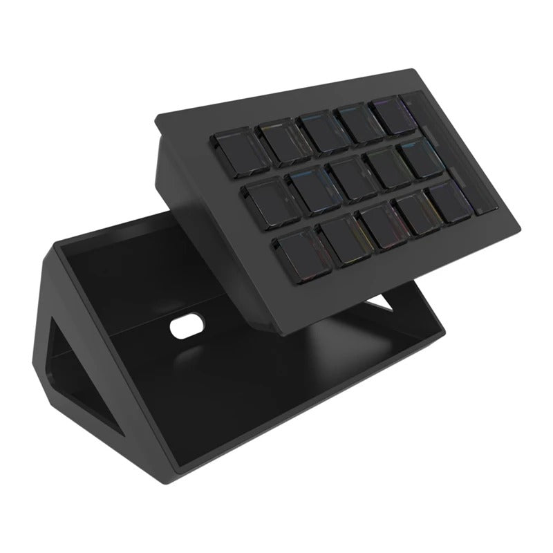 Dreemdex D10 in black — three-quarter view on stand, 15 LCD keys lit, vertical info strip on the right